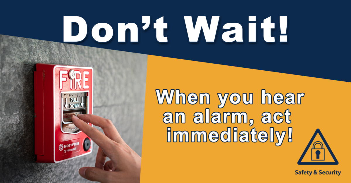 Hand pulling a fire alarm. Text: "Don't wait! When you hear an alarm, act immediately!"