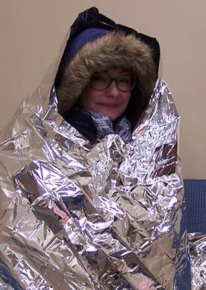 Woman in reflective blanket